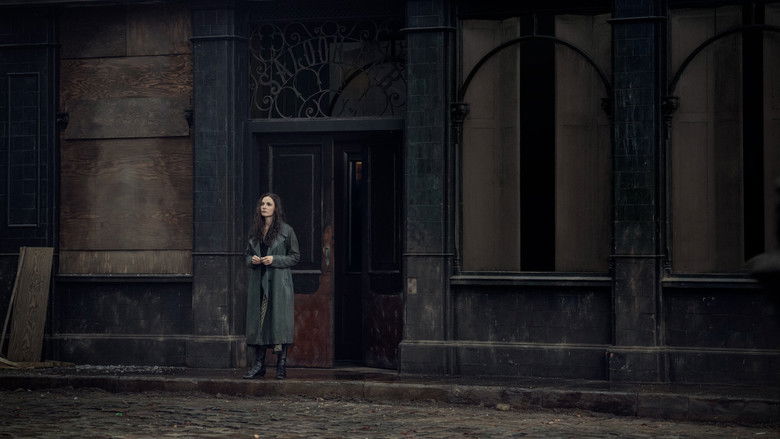 Flames reflecting on the faces of the characters in the night