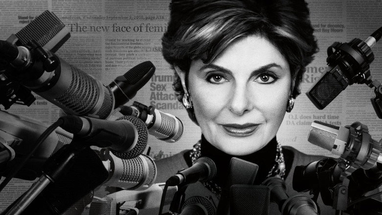 Gloria Allred in her signature red suit, addressing a crowd of reporters outside a courthouse.