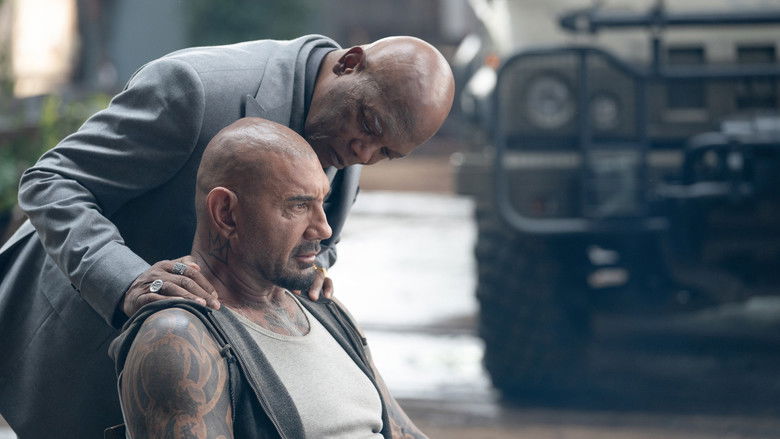 Dave Bautista walking through a dusty post-apocalyptic landscape