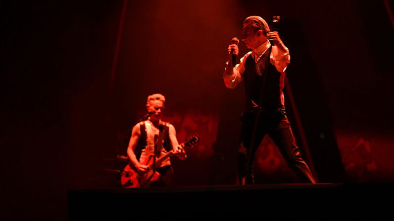 Dave Gahan mid-song, bathed in blue light, his face a map of exhaustion and ecstasy
