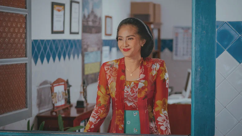 The Broto family gathers around the inn's front desk, their expressions a mix of frustration and affection as they debate modernizing the booking system.