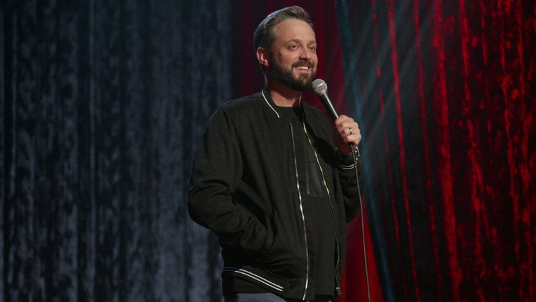 Bargatze on stage, mid-joke, hands in his pockets, looking like he's about to admit something embarrassing