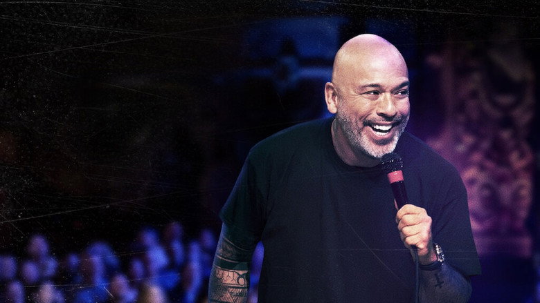 Jo Koy mid-performance, arms outstretched, commanding the stage at Brooklyn’s King’s Theatre.