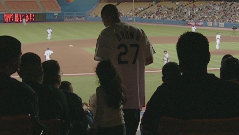 Juan Catalan and his daughter in the stands at Dodger Stadium, captured in raw footage from *Curb Your Enthusiasm*