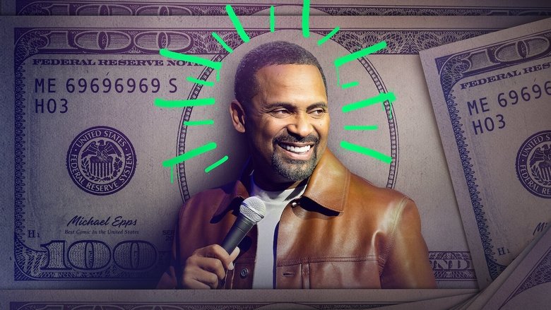 Mike Epps on stage, bathed in warm light, mid-gesture, the crowd a blur behind him