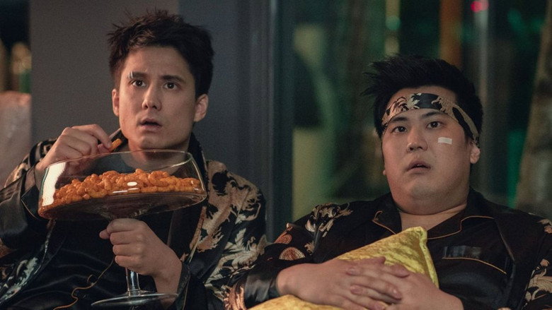 A dimly lit room with a neon sign flickering in the background, casting an eerie glow over Julien Bam and Joon Kim as they stare at a distorted reflection of themselves in a mirror.