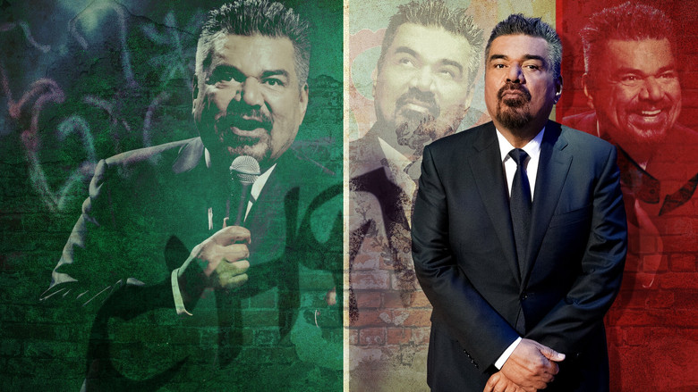 George Lopez on stage, arms outstretched, mid-joke