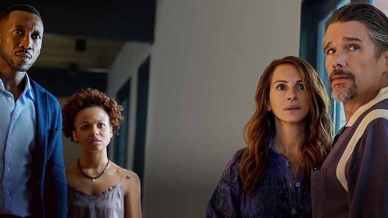 Mahershala Ali standing outside the house in the dark