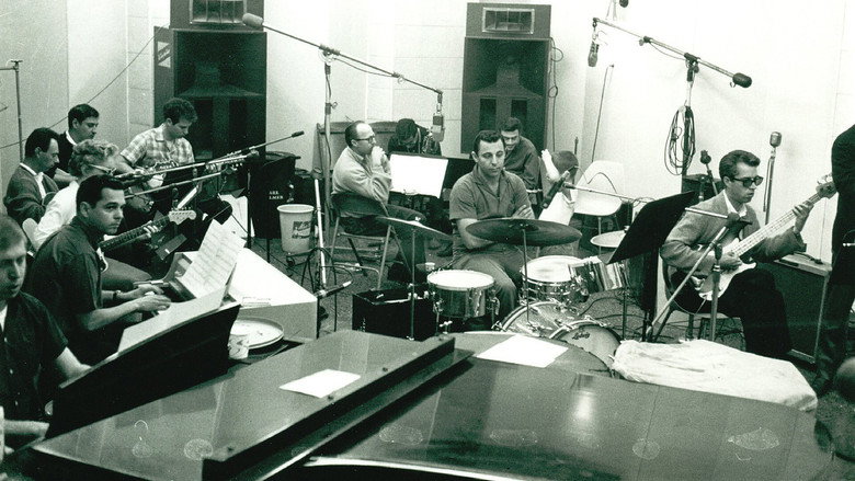 A dimly lit recording studio, instruments scattered like relics, a lone microphone standing in the center