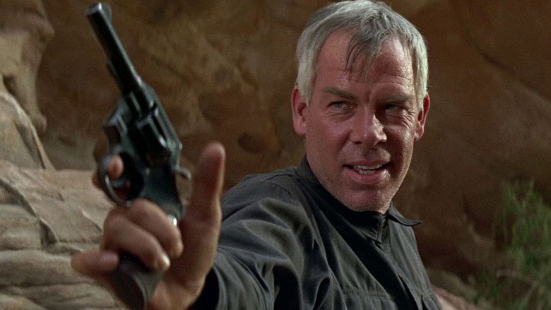 Lee Marvin and Burt Lancaster surveying the terrain with binoculars