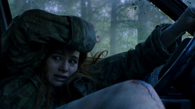 Maya hiding from her pursuers in the darkness