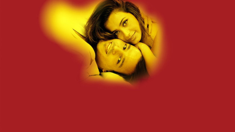 A dimly lit room where Aditya and Suhani sit on opposite sides of a bed, the distance between them palpable