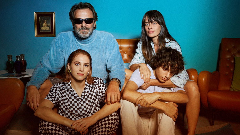 A dimly lit kitchen table, takeout containers scattered, two siblings sitting in uneasy silence
