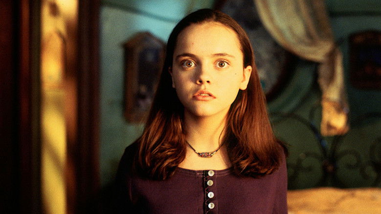 Kat Harvey, played by Christina Ricci, looks toward the unseen Casper in the dusty attic of Whipstaff