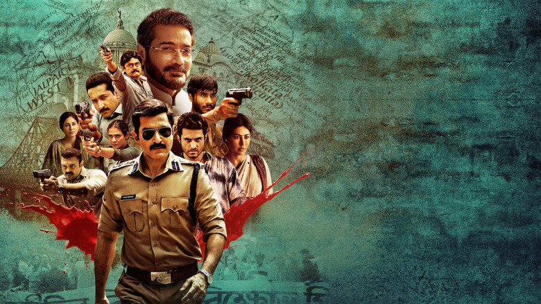 Barun Roy (Prosenjit Chatterjee) sits in a plush office, the ledger of bribes open before him, his expression unreadable as he studies the names.
