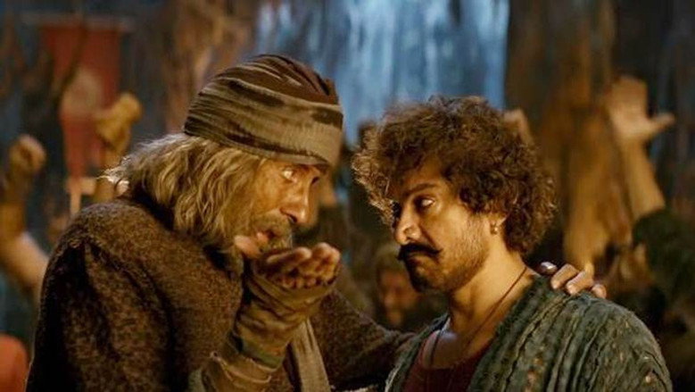 Amitabh Bachchan as Khudabaksh, standing on the deck of a ship, his gaze fixed on the horizon, the weight of leadership etched into his expression