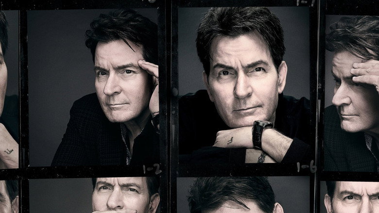 A young Charlie Sheen, grinning at the camera in a home video, sunlight catching his face.
