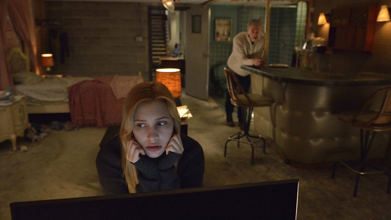 A moment of intense, quiet confrontation within the film's sterile, unsettling environments