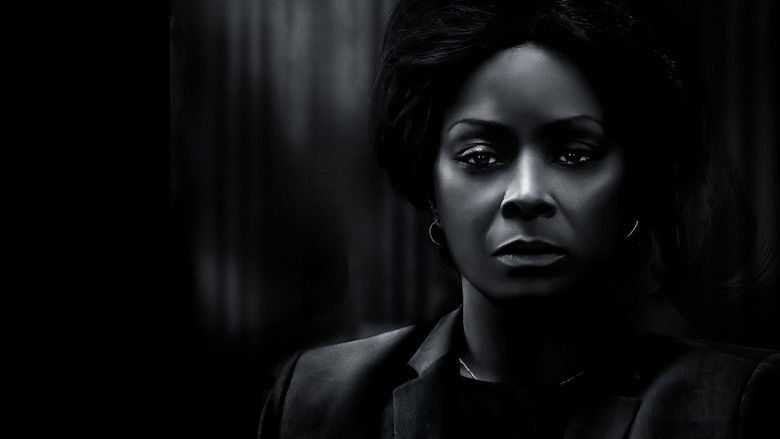A dimly lit courtroom scene, the camera angled low to emphasize the tension between the defendant and her lawyer.
