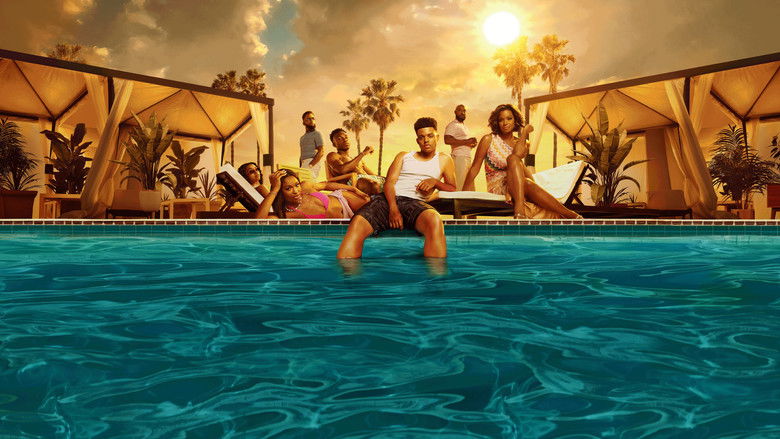 The Banks family standing together in their opulent living room