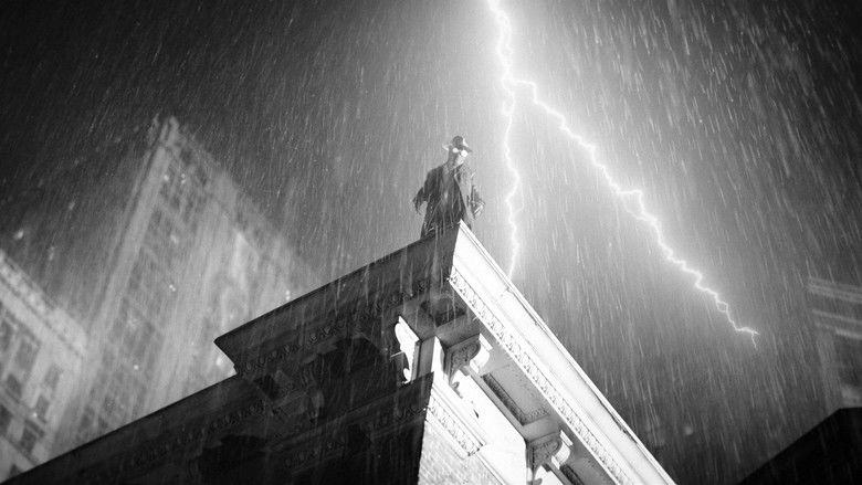A dramatic rooftop scene overlooking the city