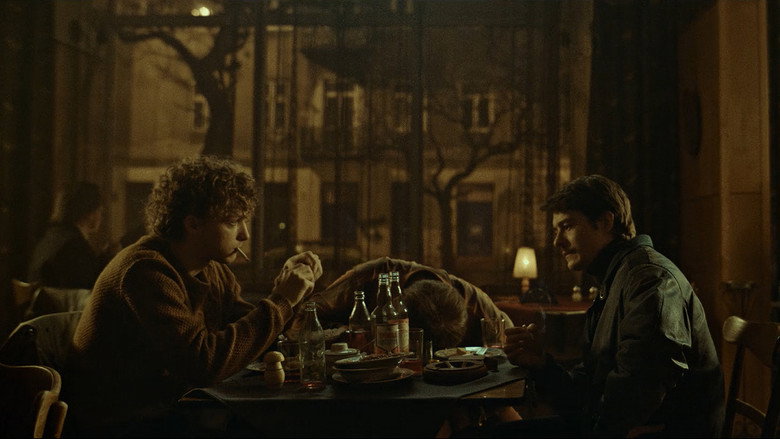 A dimly lit room, the air thick with cigarette smoke, as two men sit across from each other in tense silence.