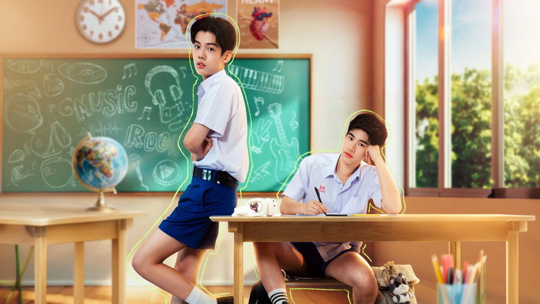 Two boys sitting on a dorm room bed, one strumming a guitar while the other watches with a mix of amusement and something softer