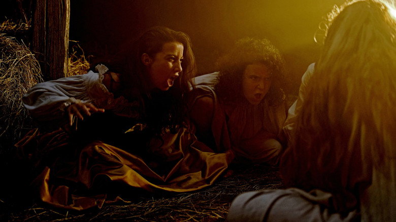 The women of *Coven of Sisters* huddle in the flickering torchlight, their faces half-lit by the fire as they whisper their plan.