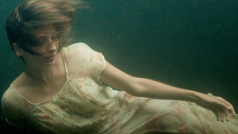 A grainy Super 8 shot of two young girls dancing, their faces blurred by time and light