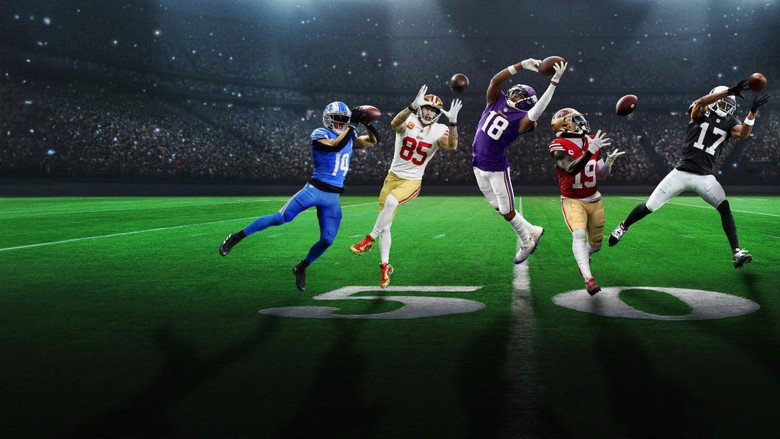 A wide receiver in full stride, his face a mix of concentration and exhaustion, the stadium lights blurring into streaks behind him