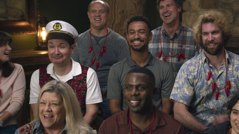 A heated, staged argument occurring during a group dinner in a rustic lodge.