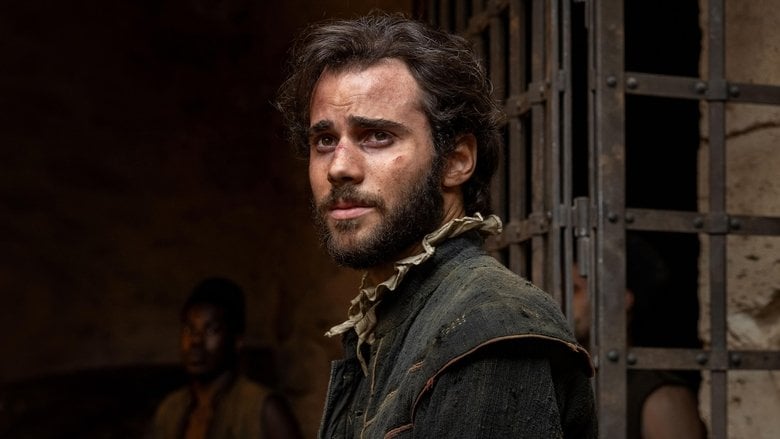 A man standing in a sunlit courtyard