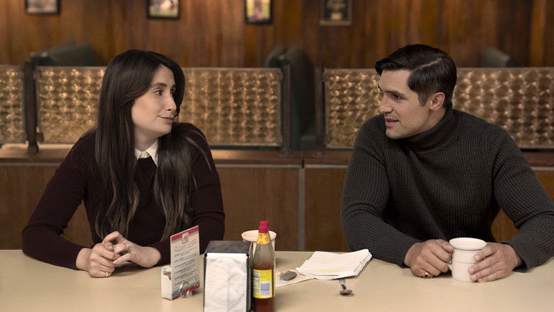A nighttime shot of a university courtyard, illuminated by soft street lamps