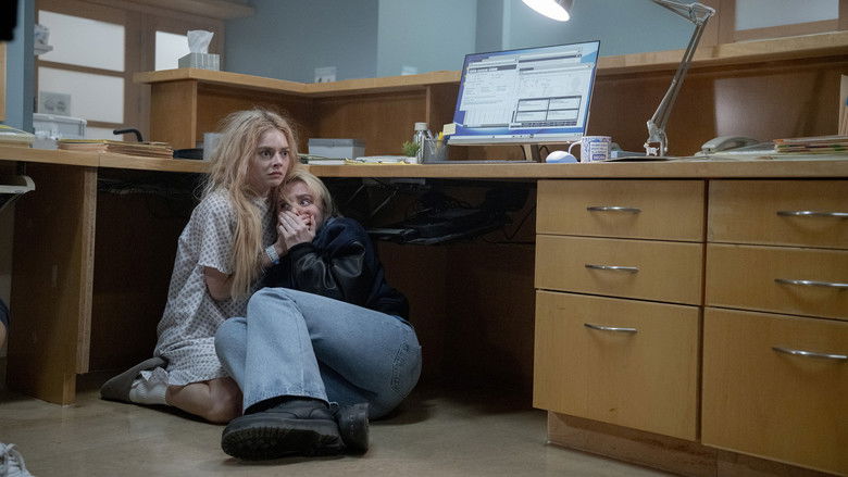 Grace covered in blood looking exhausted in the dark