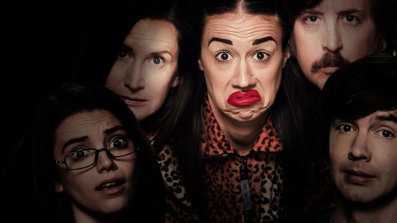 Miranda Sings, in full performance mode, surrounded by a tacky, glittery set that looks like it was assembled from a dollar store and a dream.