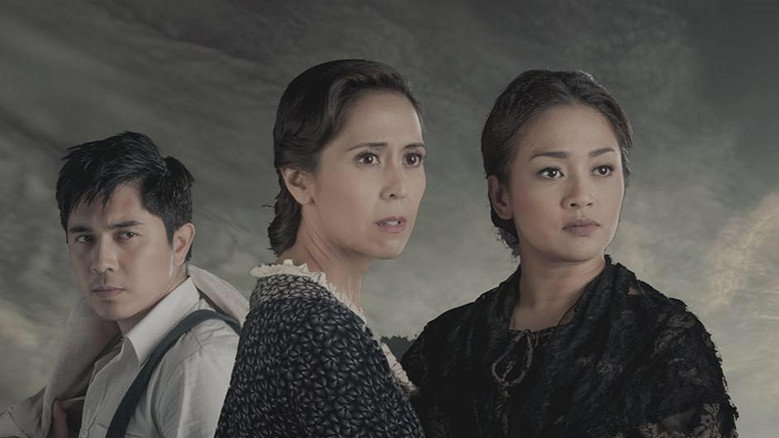 A dimly lit room where the sisters stand over their father’s portrait, the colors muted except for the gold frame catching the light.