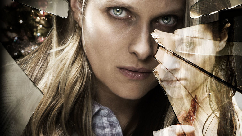 A close-up of Vinessa Shaw’s face, half in shadow, her expression tense as she listens to a patient in a dimly lit office.