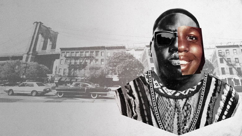 A young Biggie, mid-performance, his face half-lit by stage lights, the crowd a blur behind him