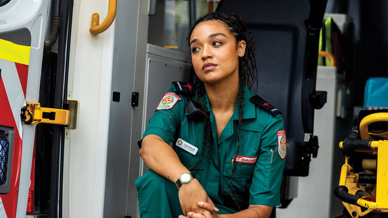 Lina standing in the dimly lit apartment, looking over her shoulder