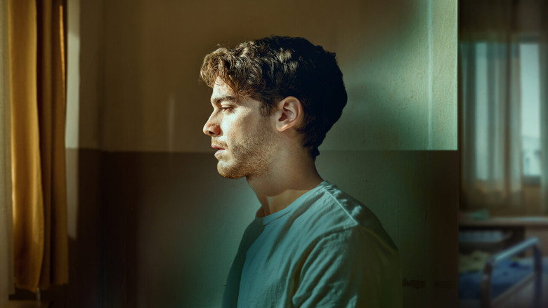 A dimly lit hospital corridor, its fluorescent lights casting long shadows, with a lone figure sitting on a bench, head bowed.