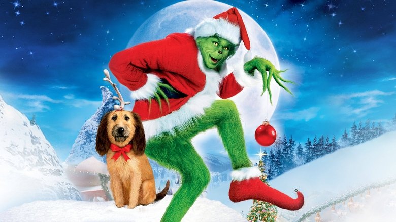The Grinch looming over a snow-covered Whoville