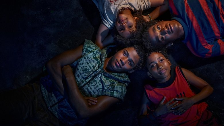 The four children huddled under a flickering streetlamp, their faces half-lit by the glow of a distant neon sign.
