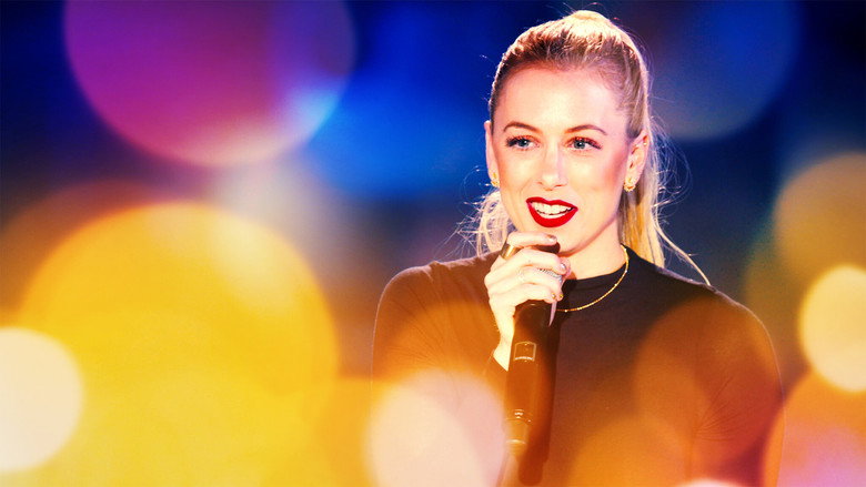 Iliza Shlesinger performing on the deck of the USS Hornet, the San Francisco Bay visible in the background.