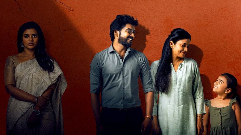 A still from *Theera Kaadhal* showing Gautham and Aaranya sitting across from each other in a café, their faces half-lit by soft, golden light.