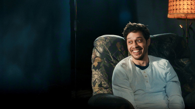 The garage set of *The Pete Davidson Show*, dimly lit with two armchairs and paint cans serving as decor