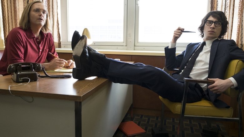 Will Forte as Doug Kenney, mid-laugh, his face lit with manic energy in a dimly lit room.