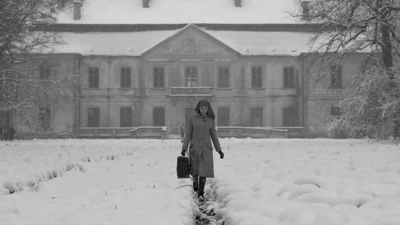 Ida stands alone in her black nun's habit