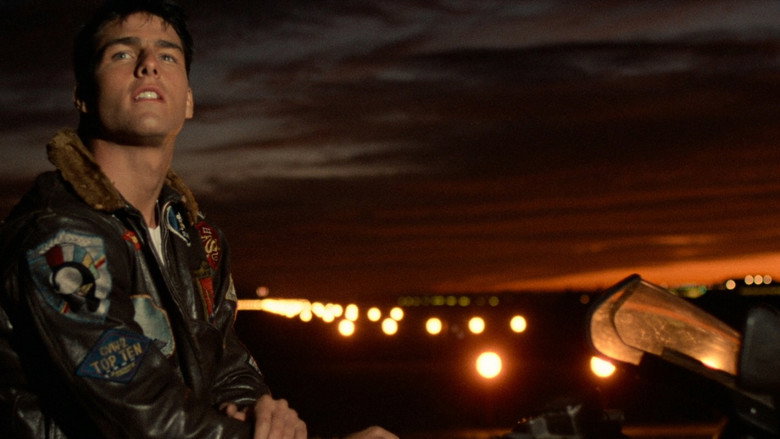 Two fighter jets locked in a tight aerial maneuver against a cloudless sky