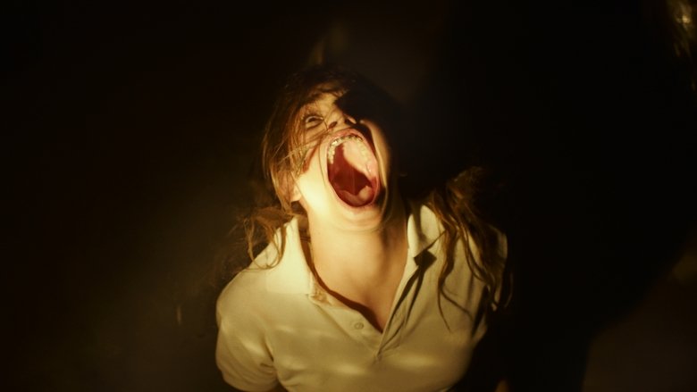 A dimly lit room where Veronica and her siblings huddle together, the glow of the Ouija board casting eerie shadows on their faces.