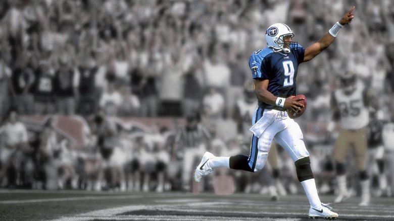 A slow-motion replay of McNair’s spiral arcing toward a receiver, sunlight catching the laces